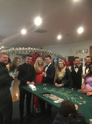 Casino-themed party with guests enjoying blackjack table entertainment in Auckland