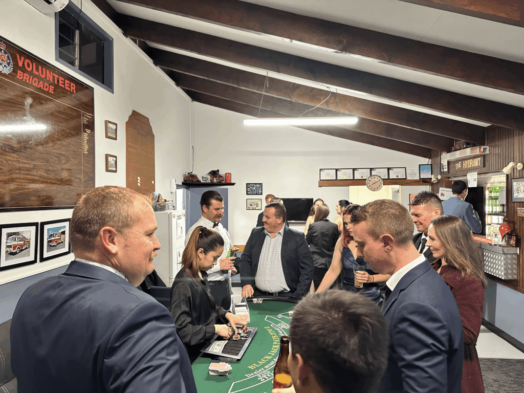 firefighters casino night fundraiser in Auckland – roulette table with guests